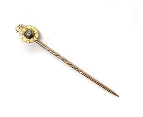 A gold Royal Marines stick pin, unmarked, the stick testing as 9ct and the terminal testing as 14ct or higher, 2.2g 