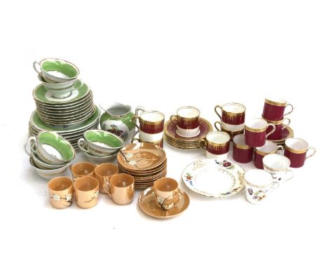 A Victoria Czech green part tea set with fancy bird design; Aynsley coffee cans and saucers with red rim; and Japanese lustre