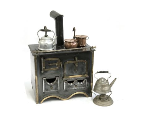 A vintage miniature enamel and brass range cooker, with gas fitting, 32cmW, with miniature kettle, copper pans etc 