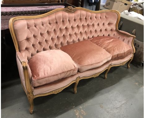 A Louis XV style continental button back sofa with carved frame 