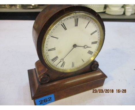 A small wooden mantel clock 
