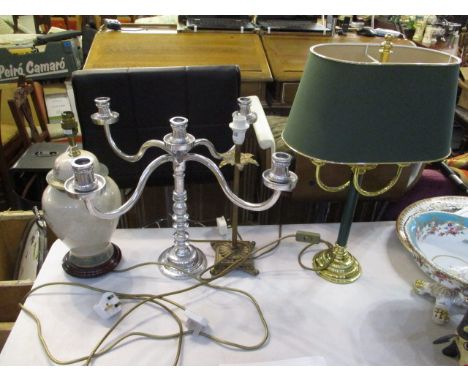 A selection of lamps to include an oriental vase converted into a lamp and a pewter candelabra 