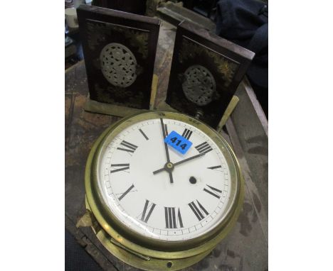 An early 20th century brass framed ship's clock, together with two Chinese bookends 