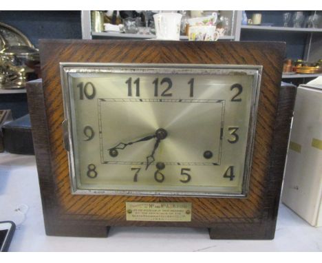 A 1930s oak cased mantel clock 