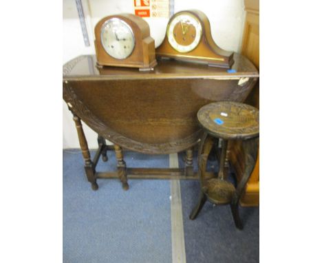 An oak drop leaf table A/F, together with a carved hardwood plant stand, 28"h x 33"w (folded), together with two vintage mant