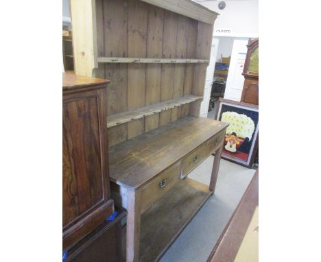 A Victorian pine dresser having plate rack to the top, three short drawers and shelf below, 81"h x 63"w 