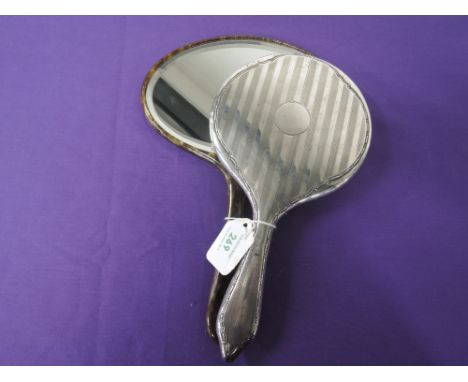 A silver dressing table hand mirror  having engine turned and moulded decoration, Chester date and makers marks worn, and ano