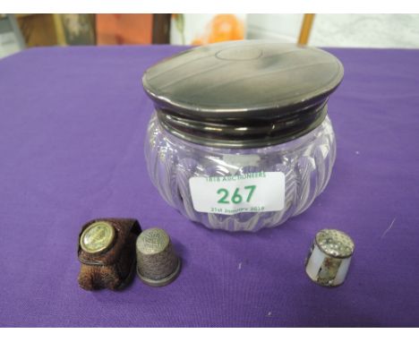 A cut glass dressing table pot with HM silver push on lid with engine turned decoration, and two thimbles