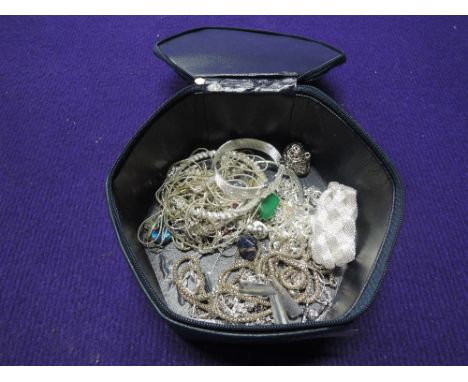 A Christian Dior zip box containing a selection of white metal fashion jewellery