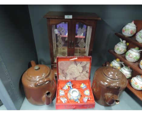 Two large stove kettles with brown enamel finish, Chinese tea set and jewellery cabinet