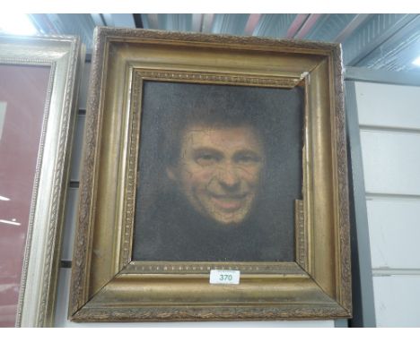 A antique oil on canvas depicting portrait of grinning man 