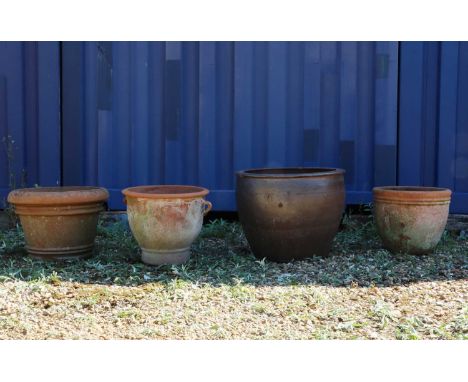 A group of four Italian terracotta garden planters,to include a glazed example, 63cm diameter, 48cm high, two examples with r