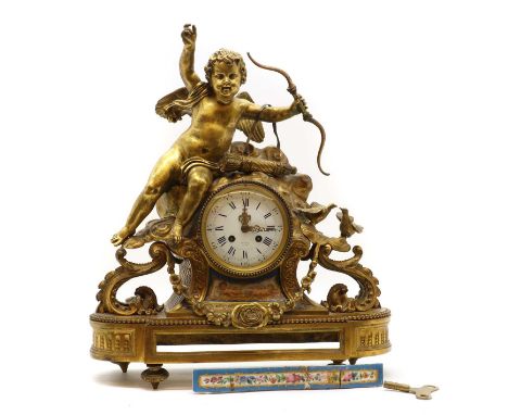 A French gilt spelter mantle clock,the case modelled with a cupid, above an enamel dial inscribed 'Hry Marc A Paris', enclosi