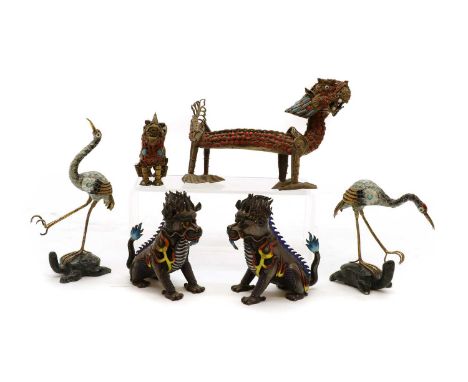 A collection of Chinese gilt metal and enamel figures,to include a dragon, three Dogs of Fo, and a pair of herons, the larges