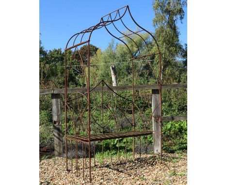 A wrought iron garden arbour seat,with a pointed canopy,126cm wide64cm deep223cm high, seat 47cm highCondition ReportHeavily 