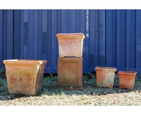 A group of four Italian terracotta garden urns,of square form,the largest;60cm square 57cm highthe smallest;36cm square37cm h