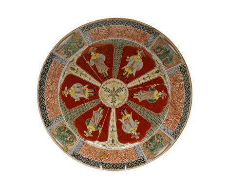 A Japanese export charger,late 19th century, the rounded sides rising from a circular foot, the centre painted with court fig