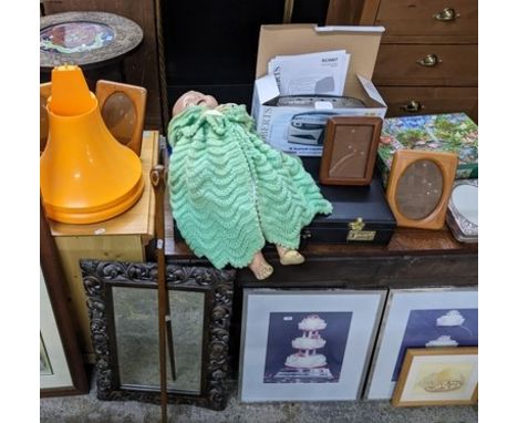 A mixed lot to include framed and glazed prints including, various photograph frames, 1930s composition headed doll with slee