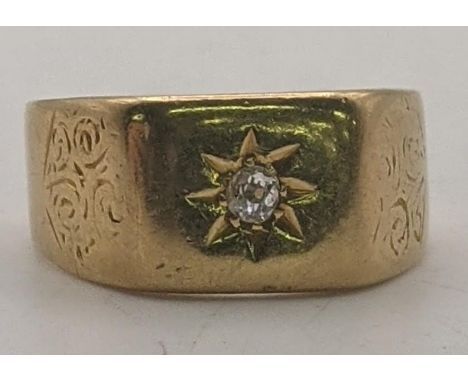 A 18ct gold gents Starburst signet ring set with a central diamond, engraved floral design, size R 1/2, 6.1gLocation: 