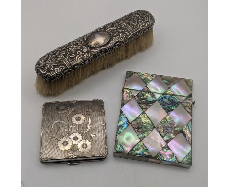 A silver compact having an engine turned design having engraved flowers to the front, together with a mother of pearl card ca