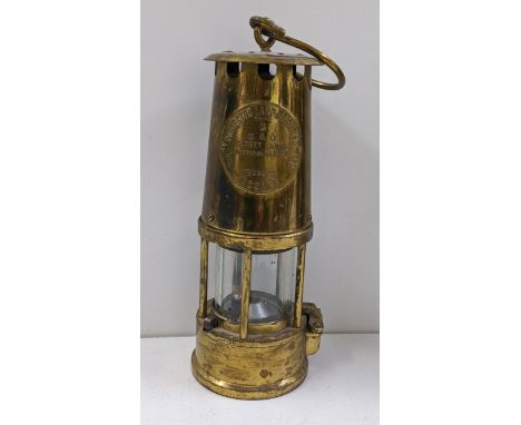 An Eccles type 6 brass miner's lamp by The Protector Lamp &amp; Lighting Co Ltd Location: 