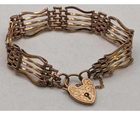 A 9ct gold rose gold gate line bracelet having a heart shaped clasp, with engraved floral decoration, 9.3gLocation: 