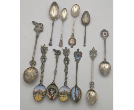 Silver and white metal collector's spoons to include four white metal gilt teaspoons having enamel bowls to include one depic