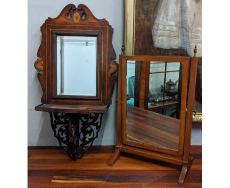 An Edwardian inlaid mirror with a shelf, and a mahogany swing mirror Location: 