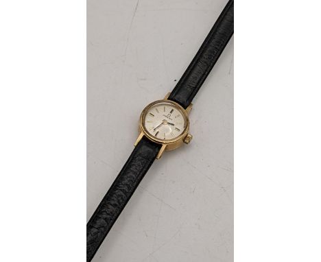 An Omega 1960s ladies 9ct gold manual wind wristwatch on a black leather strap, with a 9ct gold Omega buckle Location: 