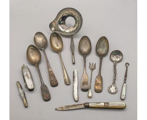 A mixed lot to include five silver spoons and a white metal toddy ladle 145.9g, along with a mother of pearl and silver fruit