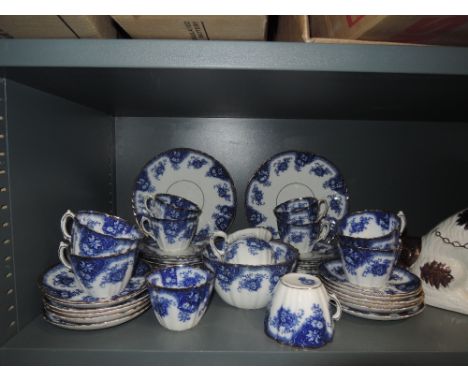 A part tea service by Royal Albert with blue and white print bearing early stamp