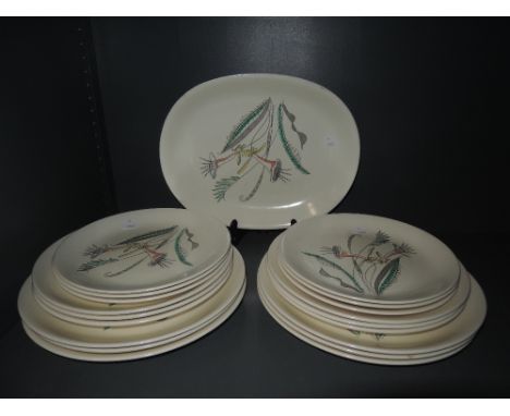 A selection of serving and dinner plates by Crown Devon 