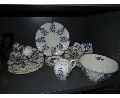 A part tea and dinner service with blue and white print bearing BB china mark to base and similar Wedgwood coffee cups and sa
