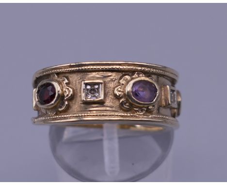 A gold diamond and multi-gem ring. Ring size N/O. 7 grammes total weight.