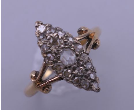 An 18 ct gold and diamond navette ring. Ring size N/O. 4.1 grammes total weight.