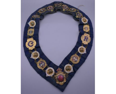 A collection of enamel lodge badges. 