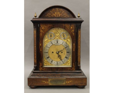 A Victorian inlaid rosewood cased striking bracket clock, the dial inscribed Joseph G Cairns Portsmouth, the case bearing pre