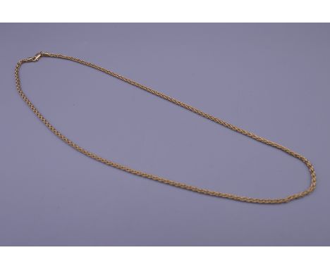 An 18 K gold necklace. 46 cm long.  12.1 grammes.
