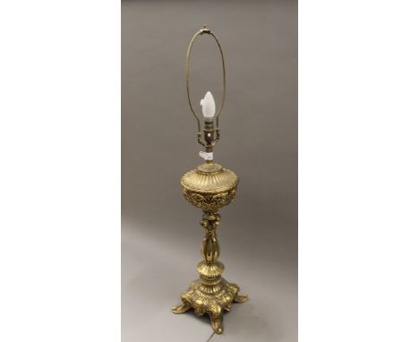 A brass table lamp. 90.5 cm high overall.
