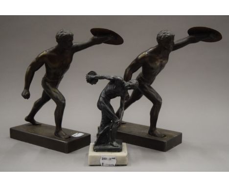 A pair of spelter models of gladiators, together with a small model Discus. The former each 22.5 cm high.