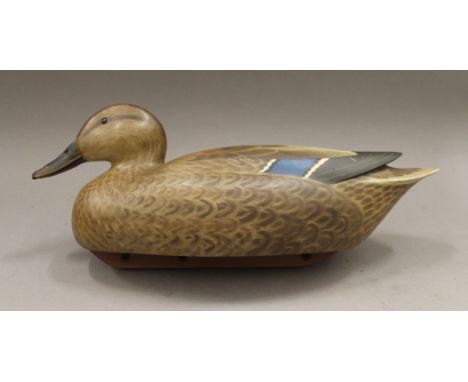 A decoy duck by R R Jeeves. 38 cm long.