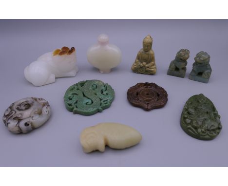 A quantity of Chinese jade carvings. The snuff bottle 6 cm high.