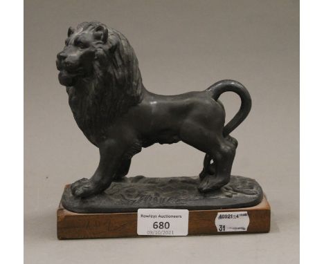 A 19th century cast model of a lion. 16 cm long.