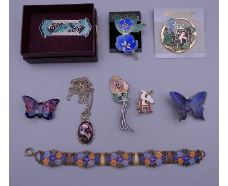 A quantity of enamel jewellery.