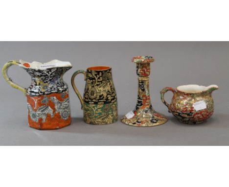 Four pieces of Mason's Ironstone comprising of three jugs and a candlestick