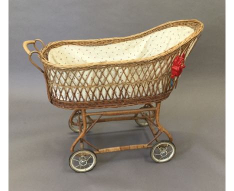 A vintage wicker pushchair/cot