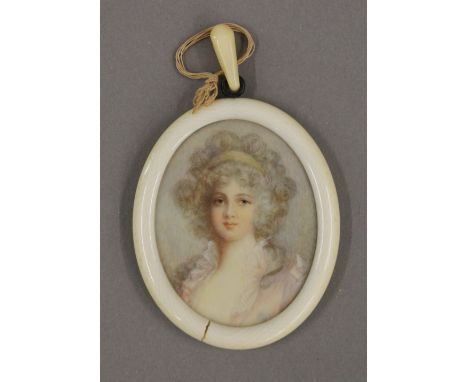 A Victorian portrait miniature on ivory depicting a young girl, housed in an ivory frame