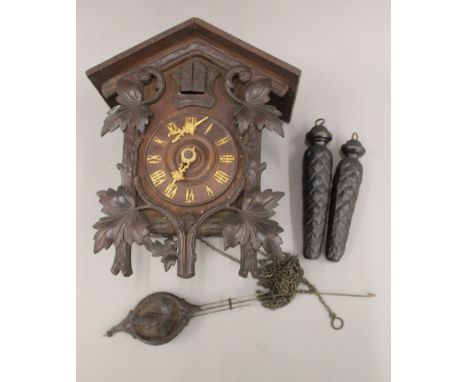 A vintage Black Forest oak cuckoo clock