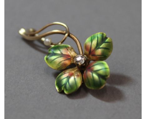 A 10 K gold, enamel and diamond brooch (1.9 grammes total weight)