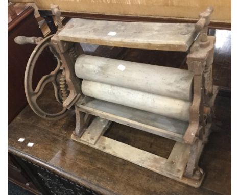 A vintage tabletop mangle, of typical form.